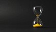 © SinemArt - Modern hourglass on black background. Hourglass time concept for business deadline, urgency and outcome of time