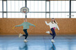 © Luciano Spinelli/Stocksy - Girls Having fun training synchronized movements in gymnasium