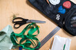 © Basil Pind/Stocksy - Sewing tools and materials on a wooden table