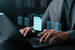 © Thapana_Studio - Businessman using laptop with digital checklist icons on screen, representing task management, document workflow, productivity, data organization, and digital business solutions.