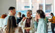 © VICTOR TORRES/Stocksy - casual networking event with diverse group of professionals