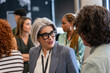 © VICTOR TORRES/Stocksy - Business professionals networking at an event