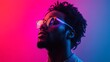 © dewpra - Portrait of a stylish man illuminated by vibrant neon lights and trendy glasses