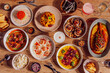 © Marta Mauri/Stocksy - Table full of Peruvian food at a restaurant