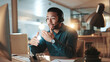 © peopleimages.com - Computer, contact us and explain with man in call center for assistance, help or support at night. Communication, headset and solution with person at office for online customer service in evening