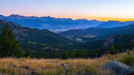 Poster - Majestic sunset over mountains and tranquil valley with trees