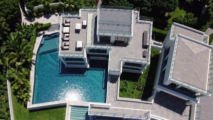 Poster - Luxurious modern villa swimming pool aerial view, rooftop terrace, lush greenery, tropical outdoor architecture, peaceful vacation