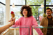 © Ivan Jovanovic/Stocksy - Woman buys ice cream