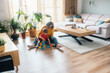 © Santi Nuñez/Stocksy - Grandmother and grandson playing with building blocks at home