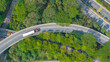 © Jim Xiang/Stocksy - The container truck is on the highway.