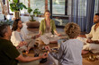 © Rido - Multiethnic group of people practicing meditation in a circle