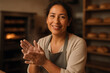 © SERHII - Latin American woman baker smiling in bakery kitchen preparing fresh artisan bread