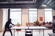 © Johnér - Male and female entrepreneur spending leisure time playing table tennis in office