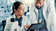 © peopleimages.com - Science, team and research on tablet in lab for medical innovation, vaccine report and experiment. Scientist, people and digital app for chemistry results, pharmaceutical development and discussion