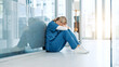 © peopleimages.com - Healthcare, nurse and stress on floor in hospital hallway with bad news, treatment fail and regret. Health expert, woman and overwhelmed with anxiety for medical doubt, clinic crisis and patient loss