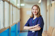 © alvaro - Young confident nurse smiling in hospital corridor