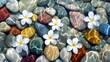 © Rahmat - White plumeria blossoms rest on colorful pebbles beneath clear water