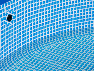 Poster - A blue and white tile pool with a camera in the middle