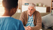© peopleimages.com - Nurse, advice and healthcare with old man on sofa for occupational therapy, listening and consulting. Medical, caregiver and retirement with senior person in nursing home for wellness and support