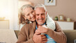 © peopleimages.com - Senior woman, man and hug on sofa with smile, care and bonding with love in retirement in lounge. Elderly people, couple and embrace with trust, loyalty and happy marriage in living room at house