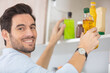 © auremar - young handsome bearded man in the kitchen