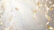 © Eireen - Golden confetti and ribbons falling on light beige background with sparkling particles and free place for text. New Year, Christmas, birthday, holiday celebration banner