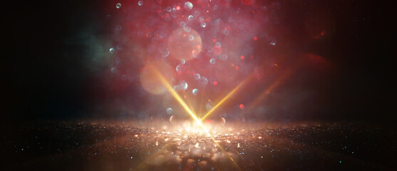 Wall Mural - abstract glitter black and gold lights background. de-focused
