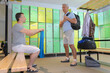 © auremar - two men using lockers in gym side view