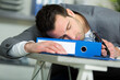 © auremar - tired businessman sleeping at desk