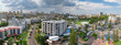 © Austockphoto - Aerial panorama of high rise apartments around a coastal recreation area