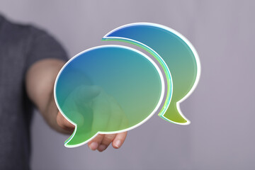 Poster - Abstract image of person presenting digital speech bubbles, symbolizing communication, conversation, and connection.