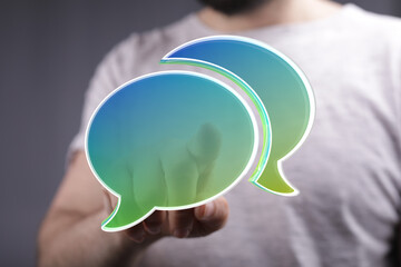 Aufkleber - Abstract image of person holding digital speech bubbles, ideal for communication, conversation, and connection concepts.