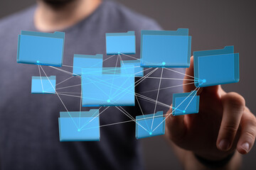 Aufkleber - Person interacting with a digital network of interconnected files and folders.  Cloud storage, data management.