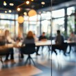 © Johannes - Defocused abstract background featuring a modern meeting room with natural light and a professional team collaborating. Ideal for business and corporate visuals.