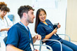 © unai - Medical students listening to presentation in conference room