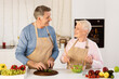 © Prostock-studio - Cheerful Aged Couple Cooking Salad Preparing Dinner In Modern Kitchen At Home. Senior Spouses Enjoying Food Preparation Together. Healthy Nutrition Recipes, Dieting In Older Age Concept