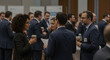 © MBK - Business Professionals Engaged in Networking Conversation at a Corporate Conference Event