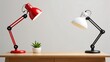 © Stock Shop - Red and white lamps with succulent on wooden desk