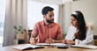 © AzeemudDeen/peopleimages.com - Finance, paperwork and couple in home with bills for budget, savings and payment invoice for mortgage. Marriage, accounting and man with woman with documents, report and financial expenses for taxes