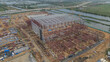© tonjung - Construction site from above. Top view of factory under construction