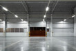 © DifferR - Concrete floor and shutter door inside industrial building at night. To construction for factory or warehouse. New clean and shiny surface. Nobody and empty space suit for product display background.