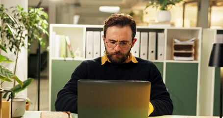 Leinwandbilder - Thinking, plan and man with laptop, office and employee with glasses, serious or marketing strategy. Reflection, brand manager and person with tech for ad campaign, contemplating and research on web