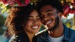 © Z A C - A young couple sharing a happy moment outdoors, smiling at the camera.