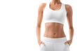 © Oksana - Woman's Midsection in White Sportswear Isolated On White Background. Woman in Sportswear Showing Abdominal Muscles