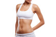 © Oksana_Latysheva - Woman's Midsection in White Sportswear Isolated On White Background. Woman in Sportswear Showing Abdominal Muscles