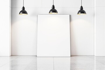 Poster - Blank white canvas leaning against a white wall under three black pendant lights.