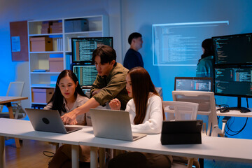 asian software engineer or programmer team working late in development office,problem solving or alg