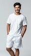 © pixs4u - A confident young man smiling while wearing comfortable white casual wear, embodying a relaxed lifestyle and positive energy.
