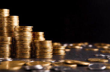 Poster - Increasing columns of gold coins on table, black background, copy space. Financial success, cryptocurrency mining, profit concept