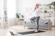 © Prostock-studio - Sporty Senior Woman Practicing Yoga With Online Tutorials At Home, Standing In Tree Pose And Smiling, Enjoying Retirement Time, Free Space